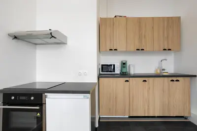 Cuisine ou kitchenette dans l'établissement Appartement Broca