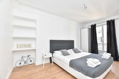 Un ou plusieurs lits dans un hébergement de l'établissement Cozy apartment 1BR 4P - Palais Royal