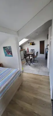 Coin salon dans l'établissement Cozy studio Clichy Levallois