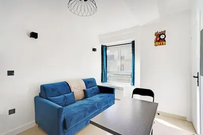 Coin salon dans l'établissement Appartement - Paris