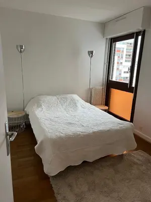 Un ou plusieurs lits dans un hébergement de l'établissement Appartement lumineux 2 pièces Paris – idéal famille
