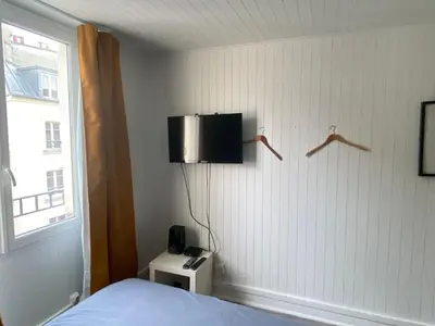 Télévision ou salle de divertissement dans l'établissement Bright Central Flat PARIS