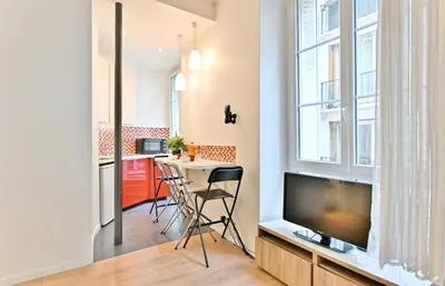 Télévision ou salle de divertissement dans l'établissement Appartement au cœur du Marais - III