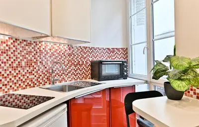 Cuisine ou kitchenette dans l'établissement Appartement au cœur du Marais - III