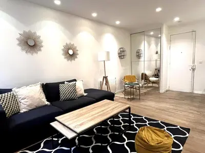 Coin salon dans l'établissement GoodGuest-Cosy Apartment Paris Montorgueil-4 PAX Bail Mobilité