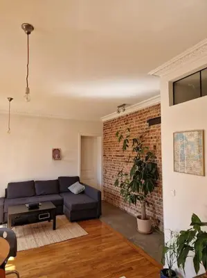 Coin salon dans l'établissement Appartement lumineux - vue sur le canal