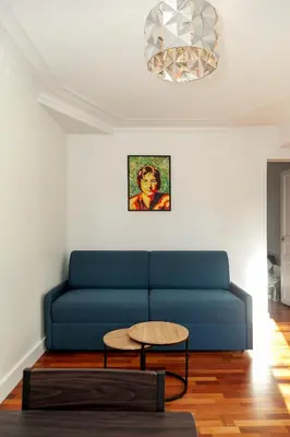 Coin salon dans l'établissement Charmant appartement - 4 couchages à proximité d'Opéra