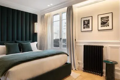 Un ou plusieurs lits dans un hébergement de l'établissement TheLander - Serviced Apartments in Champs Elysées