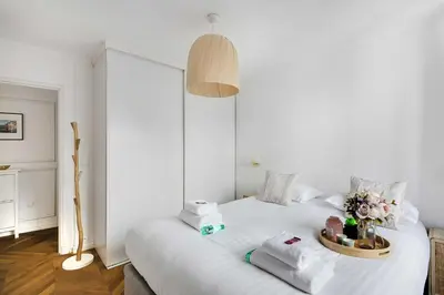 Un ou plusieurs lits dans un hébergement de l'établissement Trendy apartment - 2BR-4P - Saintonge-Le Marais
