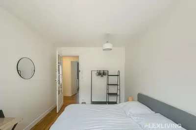 Un ou plusieurs lits dans un hébergement de l'établissement Flexliving - whole apartment - Abbé Groult