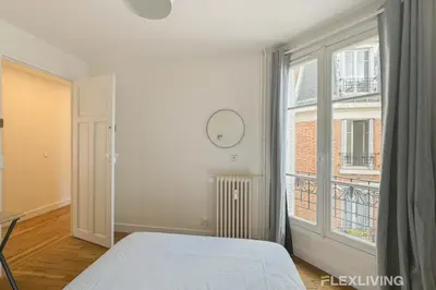 Un ou plusieurs lits dans un hébergement de l'établissement Flexliving - room - Abbé Groult