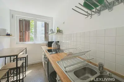 Cuisine ou kitchenette dans l'établissement Flexliving - Room - Friant