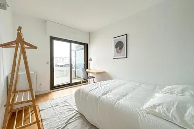 Un ou plusieurs lits dans un hébergement de l'établissement Flexliving - room - Hillairet