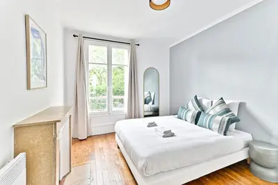 Un ou plusieurs lits dans un hébergement de l'établissement Appartement Vue panoramique sur la capitale