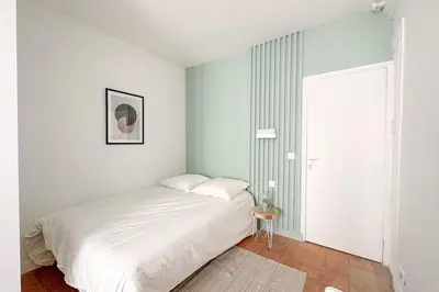 Un ou plusieurs lits dans un hébergement de l'établissement Flexliving - room - Echiquier