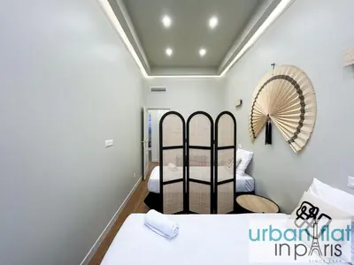 Un ou plusieurs lits dans un hébergement de l'établissement Urban Flat 188 - Sublime 4 Bedroom Apartment in Paris