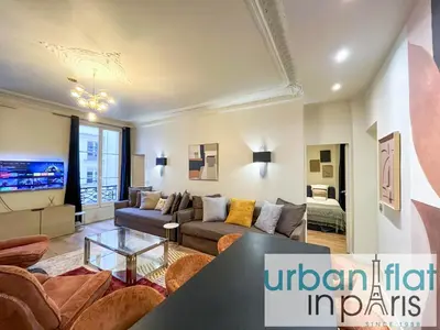 Coin salon dans l'établissement Urban Flat 63 - Beautiful 3 Bedroom Flat Champs-Elysees