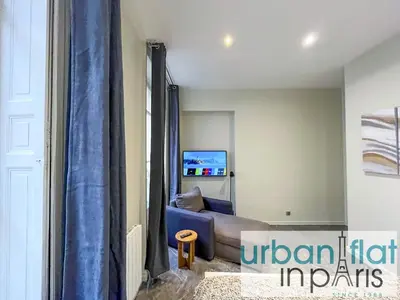 Coin salon dans l'établissement Urban Flat 63 - Beautiful 3 Bedroom Flat Champs-Elysees