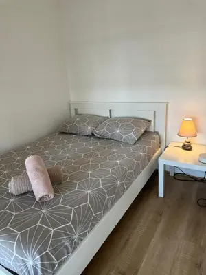 Un ou plusieurs lits dans un hébergement de l'établissement appartement magnifique et confortable