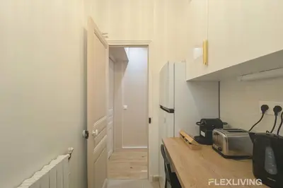 Cuisine ou kitchenette dans l'établissement Flexliving - 99 Felix Faure - Whole apartment