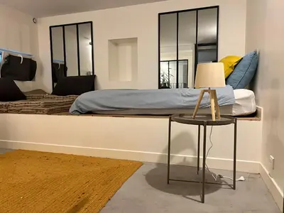 Un ou plusieurs lits dans un hébergement de l'établissement Rooms Buttes Chaumont Chambres Buttes Chaumont