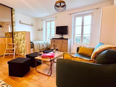 Télévision ou salle de divertissement dans l'établissement Le Penthouse Chevalier - L
