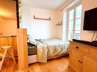 Télévision ou salle de divertissement dans l'établissement Le Penthouse Chevalier - L