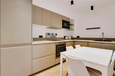 Cuisine ou kitchenette dans l'établissement REPUBLIQUE - Cozy Appartement L001