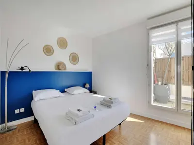 Un ou plusieurs lits dans un hébergement de l'établissement Super flat with balcony 2P 1 BDR - Levallois