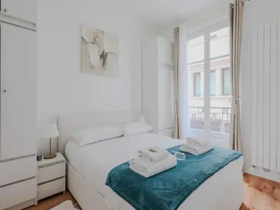 Un ou plusieurs lits dans un hébergement de l'établissement Cozy 1BDR Apt 4P Getaway in Central Paris