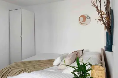 Un ou plusieurs lits dans un hébergement de l'établissement Cosy Apt with Paris Marais