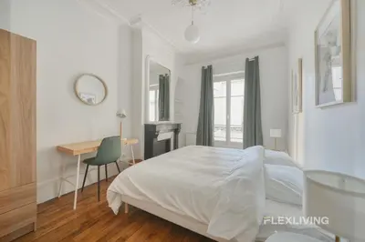 Un ou plusieurs lits dans un hébergement de l'établissement Cozy Room in Alésia Paris 14th