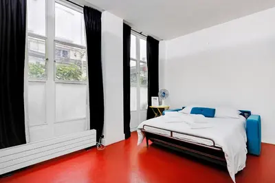 Un ou plusieurs lits dans un hébergement de l'établissement Studio Louvre Opera