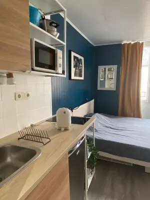 Un ou plusieurs lits dans un hébergement de l'établissement Beautiful Studio