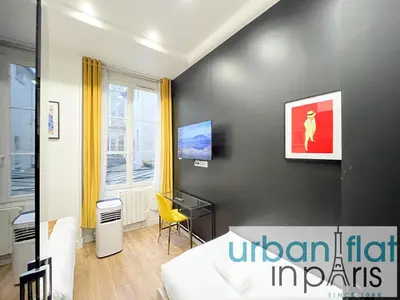 Télévision ou salle de divertissement dans l'établissement UrbanFlat 156 - Yves Apartment Saint Denis