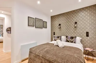 Un ou plusieurs lits dans un hébergement de l'établissement Urban Flat 104 - 4 Bedroom Flat Opera