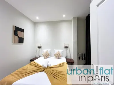 Un ou plusieurs lits dans un hébergement de l'établissement Urban Flat 64 - Luxury flat Mermoz - Champs Elysees