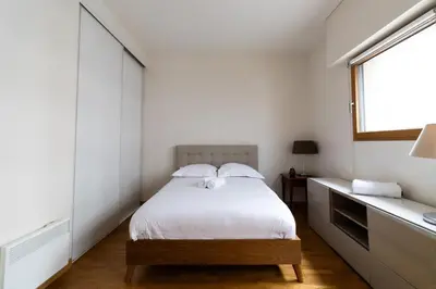 Un ou plusieurs lits dans un hébergement de l'établissement 2-Person Apartment Near Beaugrenelle - III