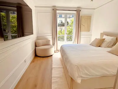 Un ou plusieurs lits dans un hébergement de l'établissement Le Penthouse Bourdonnais L