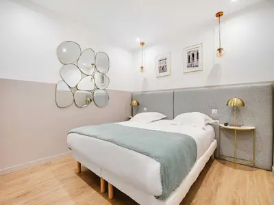 Un ou plusieurs lits dans un hébergement de l'établissement Comfort apartment 1BD 4P with AC - Near Montmartre