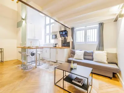Coin salon dans l'établissement Quiet apartment 1BR 4P - Place des Victoires