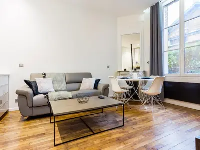 Coin salon dans l'établissement Cozy apartment - 1BR 4P - Trocadéro Eiffel Tower