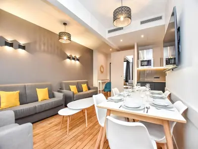 Coin salon dans l'établissement Authentic apartment - 2BR 8P - near Opéra Garnier