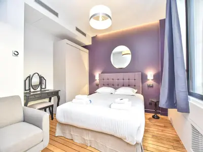 Un ou plusieurs lits dans un hébergement de l'établissement Authentic apartment - 2BR 8P - near Opéra Garnier