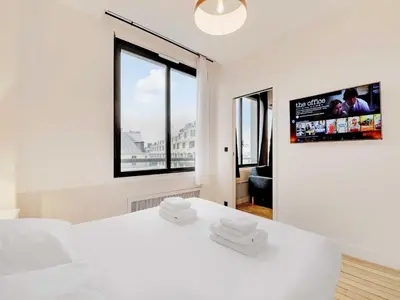 Un ou plusieurs lits dans un hébergement de l'établissement Modern apartment - 2BR 8P - near Opéra Garnier
