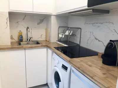 Cuisine ou kitchenette dans l'établissement Appartement moderne & cosy au cœur de Paris