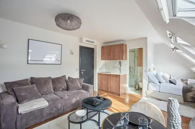 Coin salon dans l'établissement Appart'Hôtel Lou Suites
