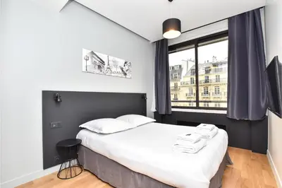 Un ou plusieurs lits dans un hébergement de l'établissement Chic apartment - 1BR 4P - near the Palais Garnier