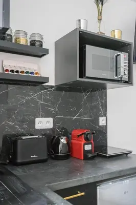 Cuisine ou kitchenette dans l'établissement Trocadéro - Studio 16