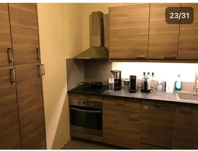 Cuisine ou kitchenette dans l'établissement Pavillon 1 à 4 personnes suite familiale et une chambre séparée